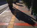 Morning sunlight on a pedestrian sidewalk Royalty Free Stock Photo