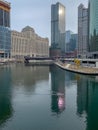 Morning sunlight shines off of skyscraper onto Chicago River