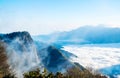 Morning sunrise, dramatic cloud of sea, giant rocks and Yushan mounatin under bright blue sky in AlishanAli mountain National Pa Royalty Free Stock Photo