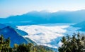 Morning sunrise, dramatic cloud of sea, giant rocks and Yushan mounatin under bright blue sky in AlishanAli mountain National Pa