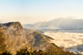 Morning sunrise, dramatic cloud of sea, giant rocks and Yushan mounatin under bright blue sky in AlishanAli mountain National Pa Royalty Free Stock Photo