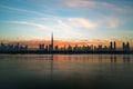 Morning or sunrise in Dubai. Dawn over Burj Khalifa. Beautiful colored cloudy sky over downtown Dubai. Glow over Royalty Free Stock Photo