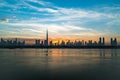 Morning or sunrise in Dubai. Dawn over Burj Khalifa. Beautiful colored cloudy sky over downtown Dubai. Glow over Royalty Free Stock Photo