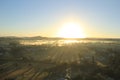 Morning sunrise over city with lot of fog Royalty Free Stock Photo