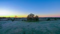 Morning sunrise over frost covered farm land