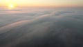 Morning sunrise over a thick autumn fog that covered the entire earth's surface. Royalty Free Stock Photo