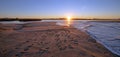 Morning sunrise reflections over tide outflow of the Santa Clara river at McGrath State Park on California`s Gold Coast USA Royalty Free Stock Photo