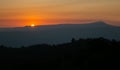 The morning of sunshine behind the Khao Yai national park mountain in the winter of Thailand. Asia sunrise view