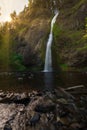 Morning sunshine at Horse Tail Falls with a stream in the foreground Royalty Free Stock Photo