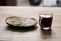 In the morning on the table a Cup of coffee and a plate of pancakes