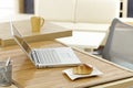 Morning table with laptop and breakfast Royalty Free Stock Photo