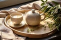 Morning tea, a kettle of tea and cup of green tea, on a tray. Chinese tea ceremony.
