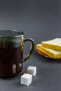 Morning tea and toast on a black background