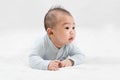 Morning Time.Adorable newborn kid during tummy time smiling happily at home.Portrait of cute smiling happy asian baby boy crawling Royalty Free Stock Photo