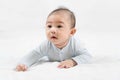 Morning Time.Adorable newborn kid during tummy time smiling happily at home.Portrait of cute smiling happy asian baby boy crawling Royalty Free Stock Photo