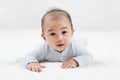 Morning Time.Adorable newborn kid during tummy time smiling happily at home.Portrait of cute smiling happy asian baby boy crawling Royalty Free Stock Photo