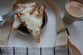 Morning toast with sheesecake and a cup of espresso.