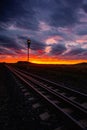 Morning train to the hell. Single railway track at sunrise