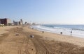 Morning Tyre Tracks and people on Beach in Durban Royalty Free Stock Photo