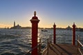 Morning in Venice, piers at Grand Canal and San Giorgio church Royalty Free Stock Photo