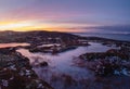 Morning view of a beautiful frozen puddles and mosses on the rocky slope of the mountain close up. Picturesque Arctic landscape in