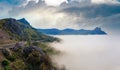 Morning view of coastline in mist (like cloudy sea) and highway (Foros Town environs, Crimea, Ukraine