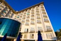 Morning view of facade hotel building with many windows and small balcones. Blue sky background. Travel and tourism concept Royalty Free Stock Photo