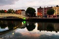 Morning view of famous illuminated Ha Penny Bridge in Dublin, Ireland