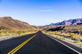 Morning view of the highway crossing Death Valley National Park, California Royalty Free Stock Photo