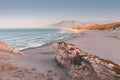 view of the Mediterranean seacoast at the Patara beach during high tide with waves. High mesmerizing rocky cliff in the Royalty Free Stock Photo