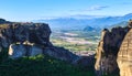 Morning view of monastery of Holy Trinity or Agia Triada, Meteora valley, villages of Kalampaka and Kastraki, mountains