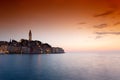 morning view of old Rovinj town with multicolored buildings and yachts moored along embankment, Croatia