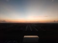 Morning view with orange sunbeam, dark landscape in city