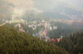 Morning view of residental area and houses around the Dragobrat mountain peaks in Carpathian mountains, Ukraine. Cloudy Royalty Free Stock Photo