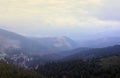 Morning view of residental area and houses around the Dragobrat mountain peaks in Carpathian mountains, Ukraine. Cloudy Royalty Free Stock Photo