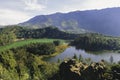 Morning view of Telaga Warna Lake with mountain background at Dieng Plateau, Central Java, Indonesia. Aerial View from Batu Royalty Free Stock Photo