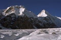 Morning view to Chapaev peak 6371m on the left and Khan Tengri peak 6995m. Royalty Free Stock Photo