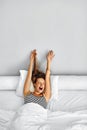 Morning Wake Up. Woman Waking Stretching In Bed. Healthy Lifestyle