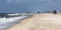 Morning walkers enjoying a beach on Fire Island Royalty Free Stock Photo