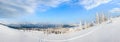 Morning winter calm mountain panorama with sheds group and mount ridge behind (Carpathian Mountains, Ukraine Royalty Free Stock Photo