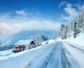 Morning winter misty rural alpine road and house Royalty Free Stock Photo