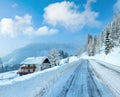 Morning winter misty rural alpine road and house Royalty Free Stock Photo