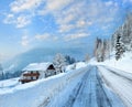 Morning winter misty rural alpine road and house Royalty Free Stock Photo