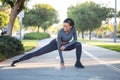 Morning workout routine: beautiful sporty girl performing split