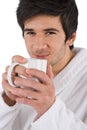 Morning - Young man in bathrobe with cup of coffee