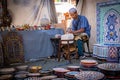 Moroccan artisan working with his hands in his workshop