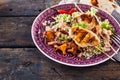 Moroccan barbecue chicken skewer dish with quinoa