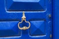 Moroccan blue door with knocker in El Jadida Royalty Free Stock Photo