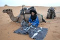 A Moroccan boy selling souvenirs at Merzouga, which lies on the edge of Erg Chebbi in Morocco.