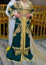 Moroccan bride and groom wearing traditional Moroccan clothes.